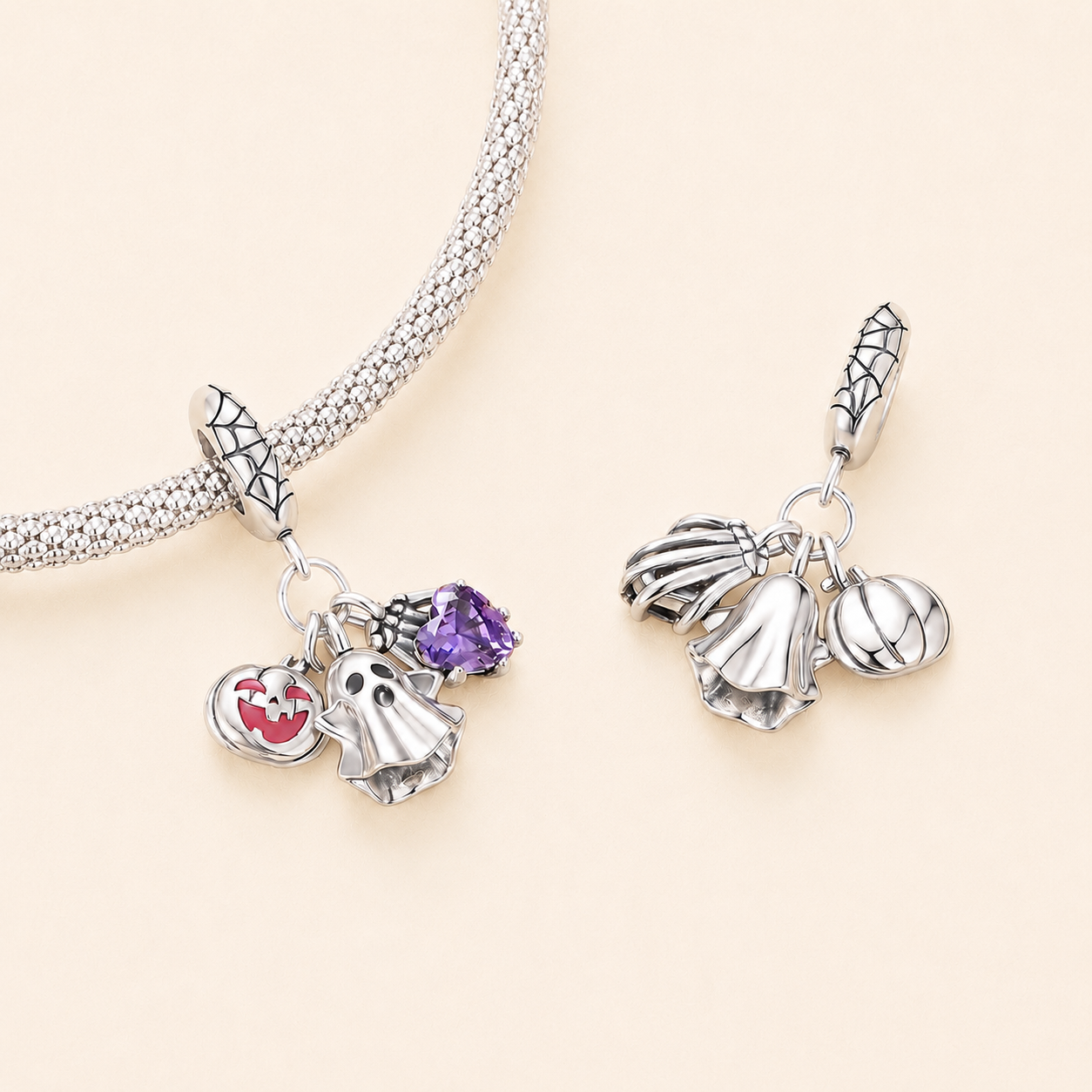 Close-up of the ghost, heart and pumpkin elements on the sterling silver dangle charm | Thaleen by Asttery