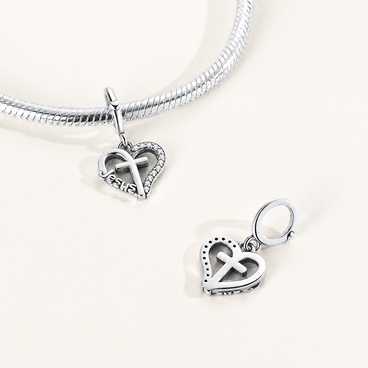 Polished sterling silver heart dangle charm engraved with Jesus and cross motif | Asttery