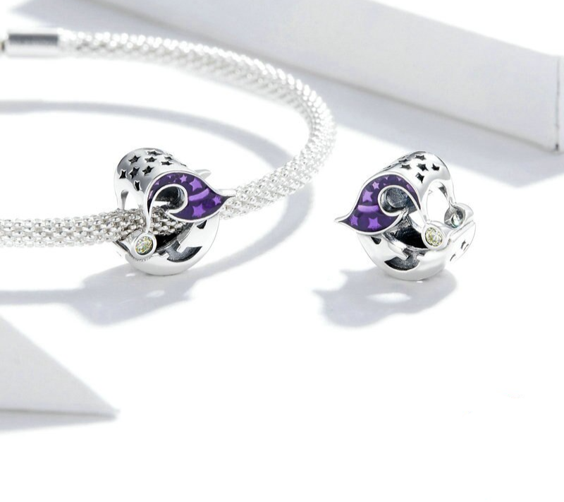 Delicately crafted moon charm with deep violet enamel hat, sparkling tip, and mystical expression, 925 silver,  Asttery
