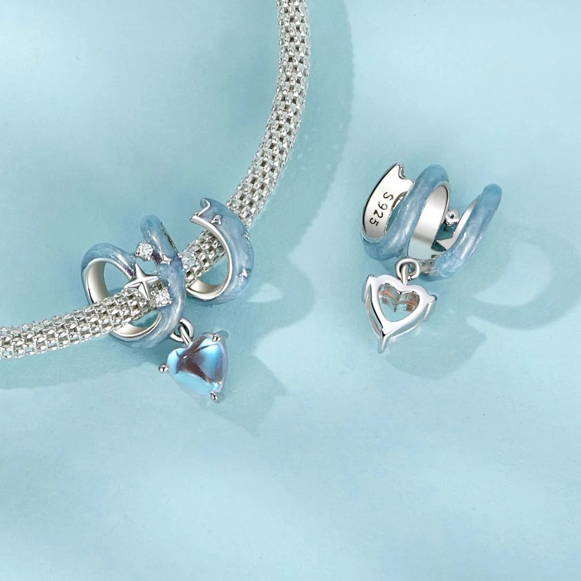Detailed Velunar charm showing star-like zirconias and moonstone heart center | Asttery
