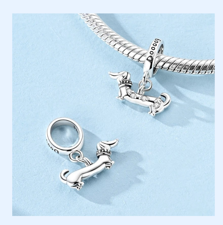 Side view of the Waffin dachshund charm showing the elongated silhouette and zirconia accents | Asttery