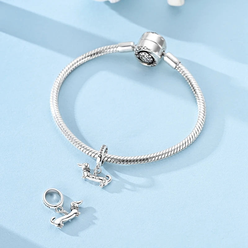 Waffin dog charm styled on a silver bracelet | Asttery