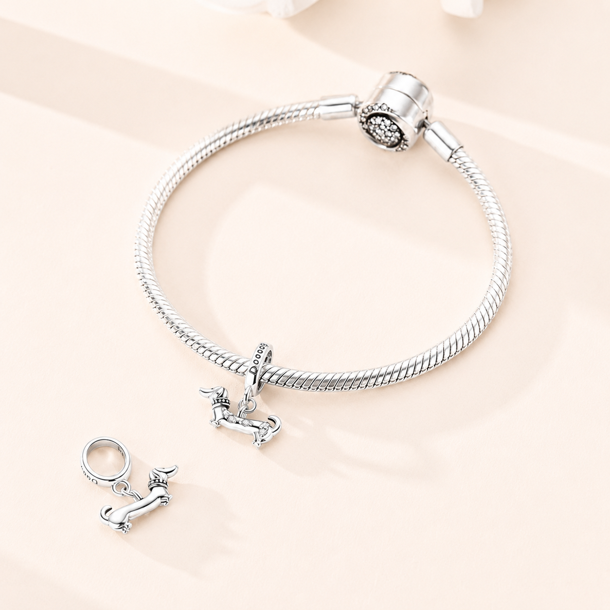 Waffin dog charm styled on a silver bracelet | Asttery