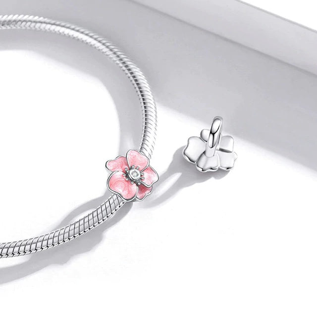 Delicate blossom-shaped charm Yuna with pearly pink petals and zirconia centre | Asttery