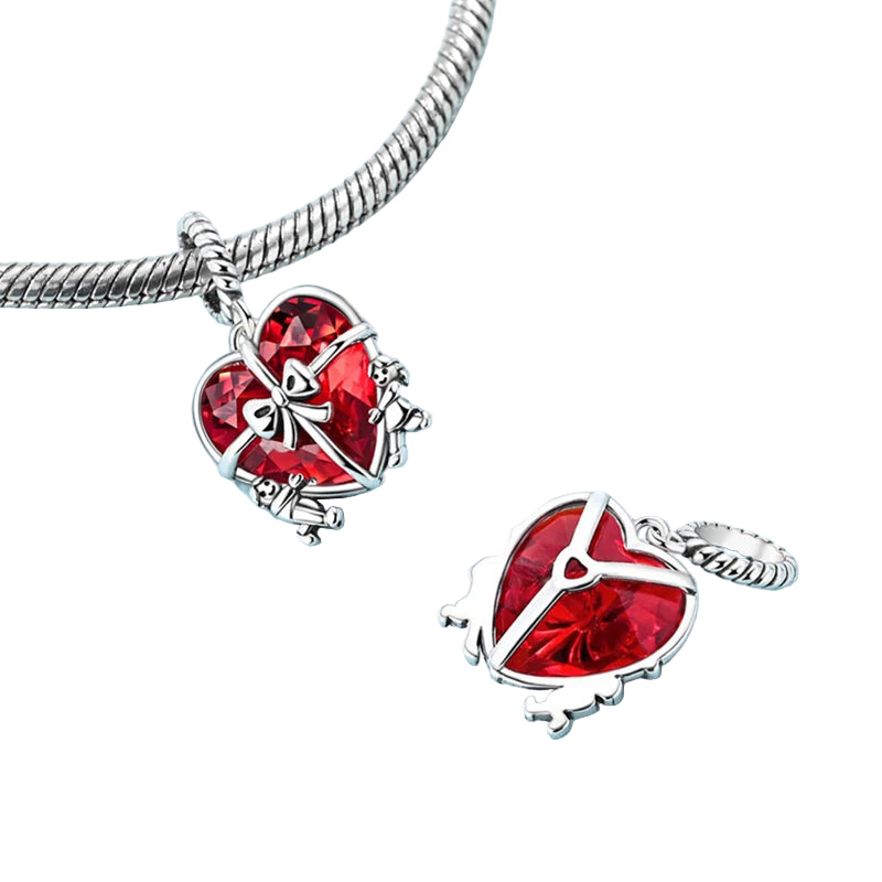 Front and back view of the 925 sterling silver heart dangle charm, shown on a bracelet, Duorin by Asttery