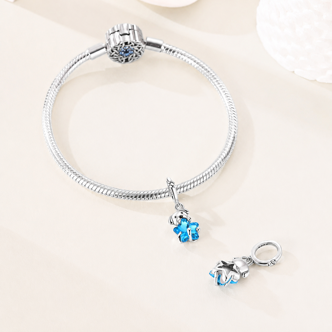 Puppy and blue star dangle charm displayed on a silver bracelet, styled for expressive jewellery | Bluvi by Asttery