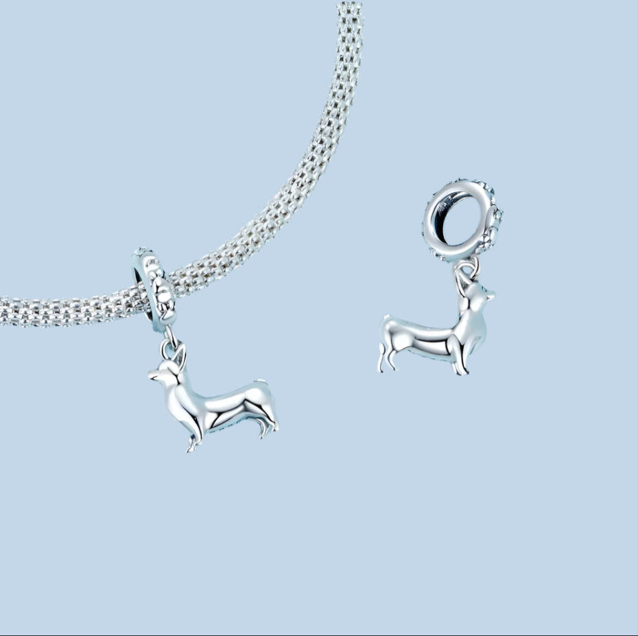 Minimalist corgi-shaped charm with detailed ears, paws, and polished silver finish, Asttery