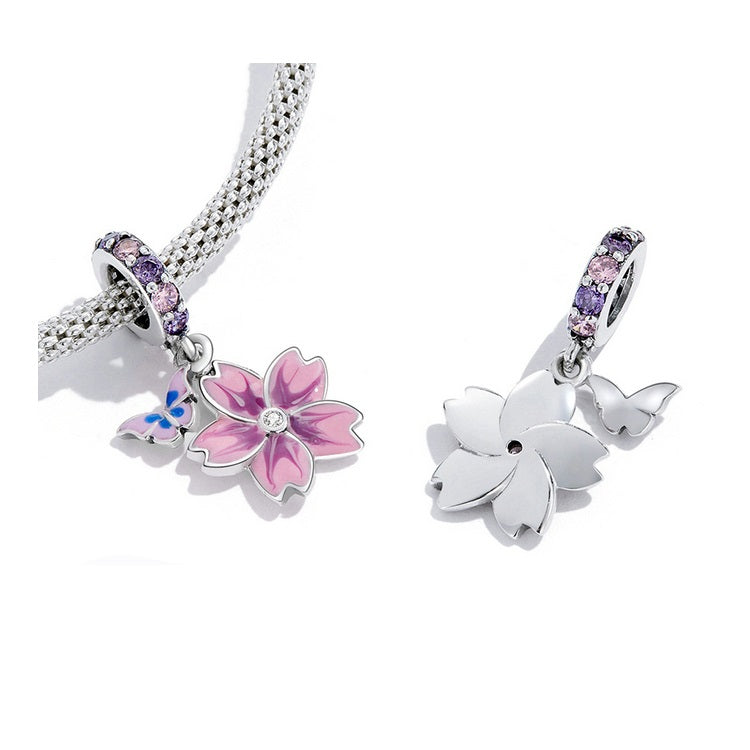 Detailed enamel flower charm with soft pink hues and pastel cubic zirconias | Asttery