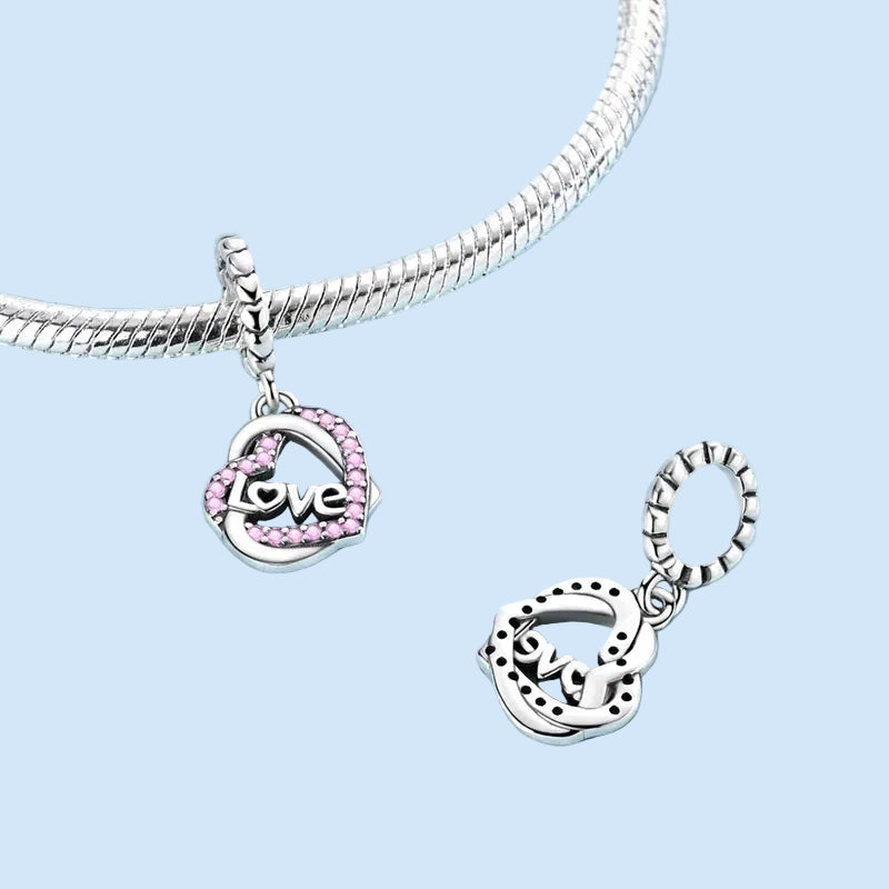 925 sterling silver heart dangle charm with light pink cubic zirconia | Asttery