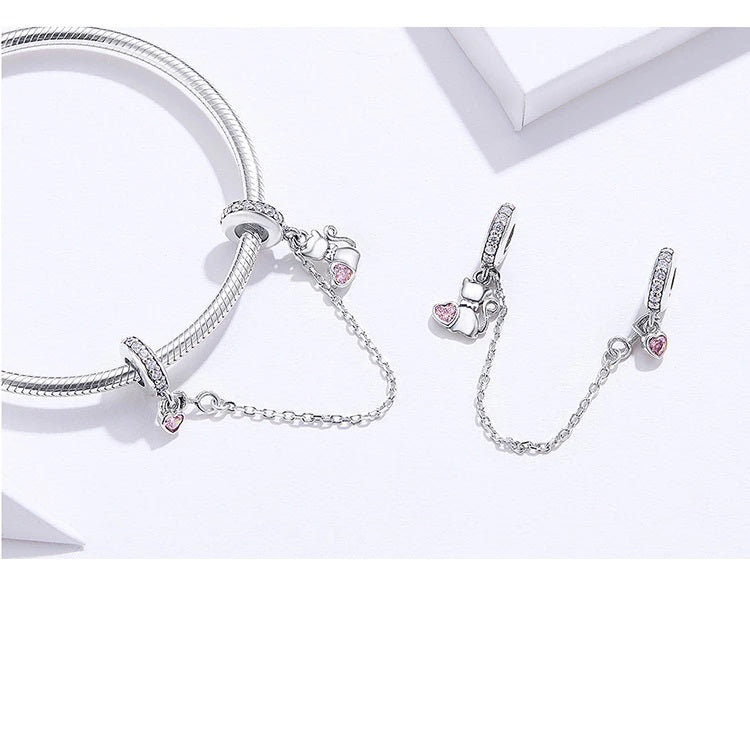 Lunexi safety charm with pink heart accents and feline symbol | Asttery