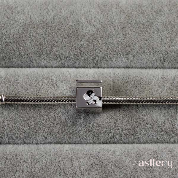 Milun  polished 925 silver charm with milk motif and minimalist enamel design | Asttery