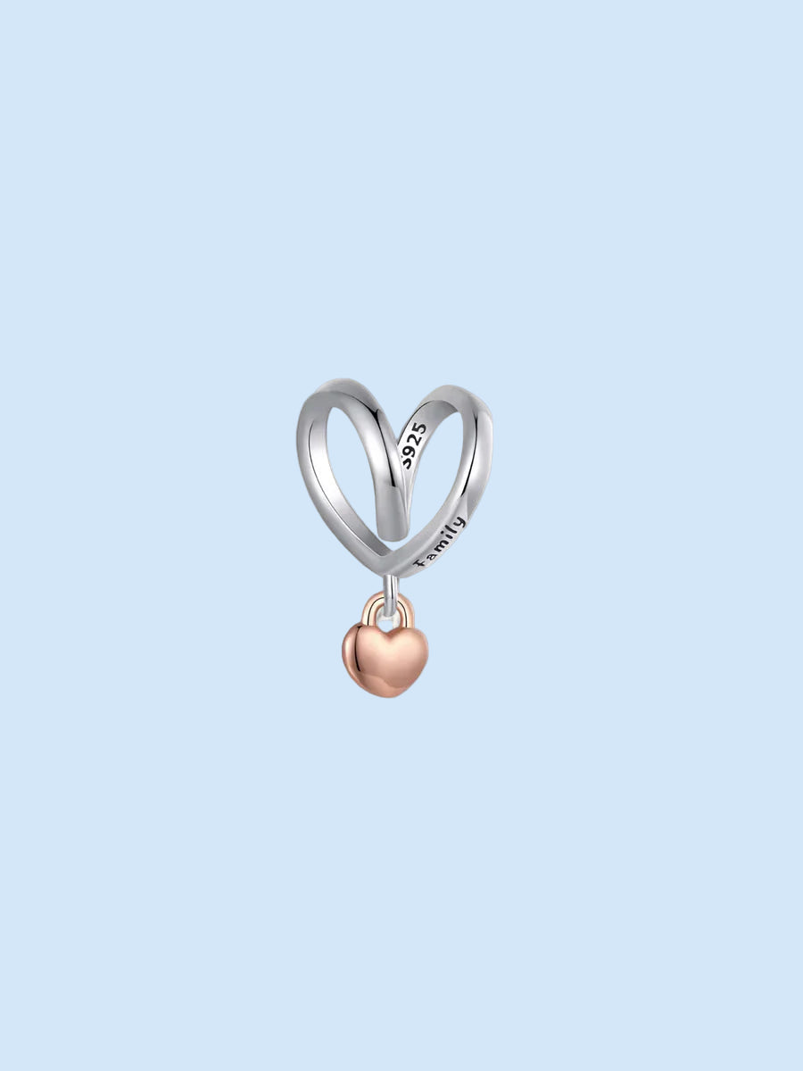 Side view of the silver heart frame engraved with ‘Family’ and rose gold lock | Asttery
