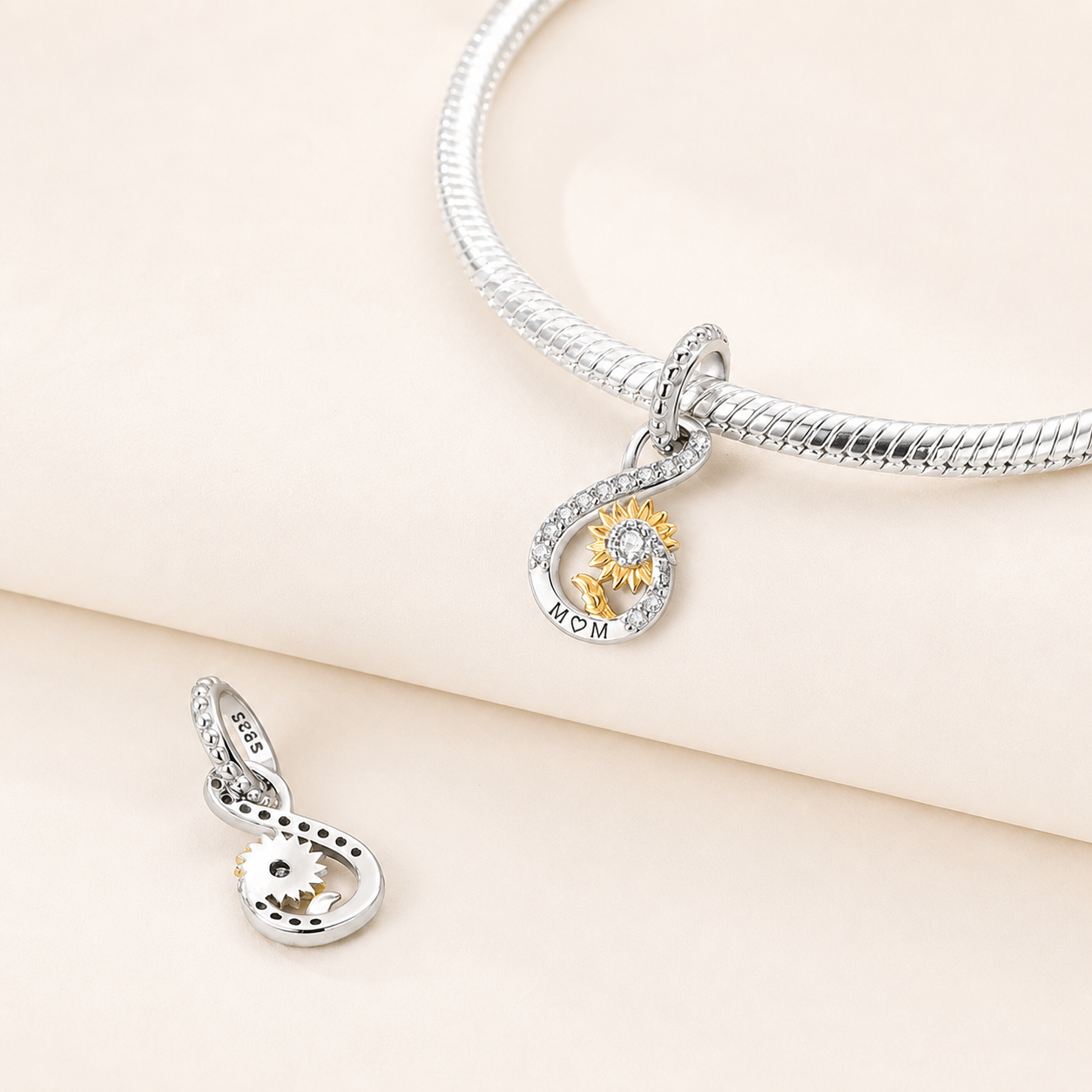 sunflower infinity charm symbolising endless maternal love with warm gold details | Asttery